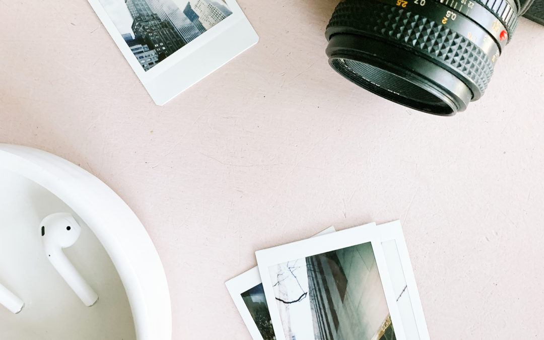 camera and photos on table